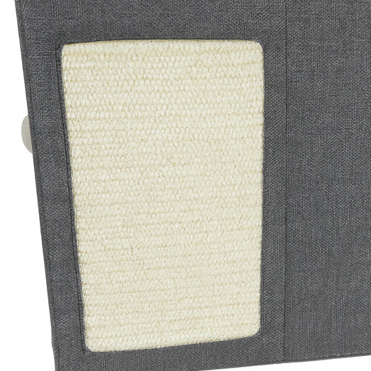 Close-up of a textured gray fabric with a white woven patch